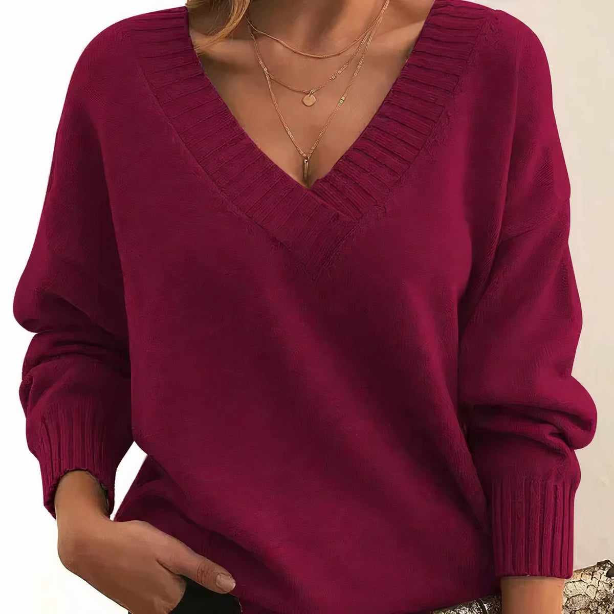 Red pleated v-neck jumper